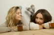 Two attractive friends drinking tea
