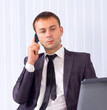 Business man working at office and calling on phone