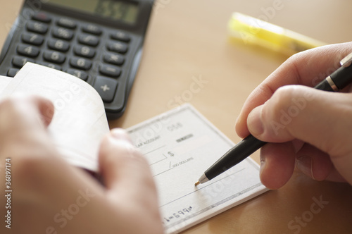 Photo: Prepare writing a check Prepare writing a check