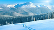 winter mountain panorama with ski track