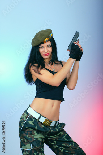 Photo: attractive girl with hand gun attractive girl with hand gun