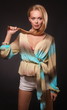 Beautiful makedup girl with hair in hands isolated on black