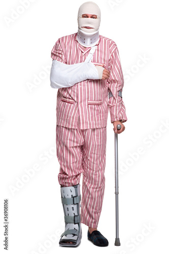 Photo: Injured man walking on crutches Injured man walking on crutches