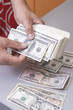 finances. guy finds big pile of money over table