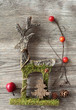 Wooden christmas deer on wooden background