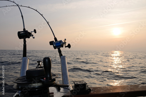 Photo: Big game fishing at sunset Big game fishing at sunset