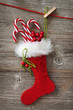 Christmas stocking hanging on wooden background