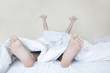 Woman stretching in bed