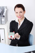 Businesswoman holding little house. Businesswoman holding little house.