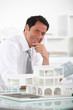 Confident architect in office
