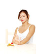 Teen girl showing stop gesture to cake. Teen girl showing stop gesture to cake.