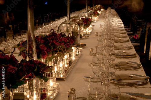 Photo: Elegant candlelight dinner table setting at reception Elegant candlelight dinner table setting at reception