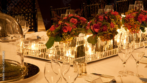Photo: Elegant candlelight dinner table setting at reception Elegant candlelight dinner table setting at reception