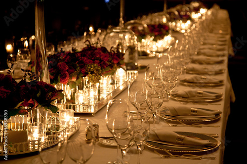 Photo: Elegant candlelight dinner table setting at reception Elegant candlelight dinner table setting at reception