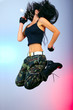 girl with gun in jump action girl with gun in jump action