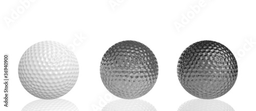Illustration: three golf balls of different materials three golf balls of different materials