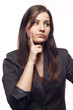 Beautiful young businesswoman thinking