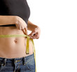 Woman measuring waistline with a tape