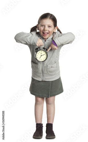 Foto: bambina con sveglia bambina con sveglia