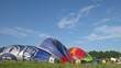 Workers ready hot air balloons before flight