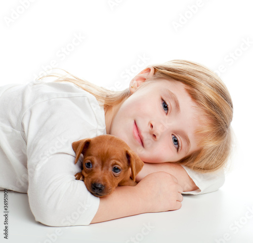 Photo: blond kid girl with mini pinscher pet mascot dog blond kid girl with mini pinscher pet mascot dog