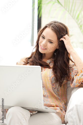 Photo: happy woman with laptop computer happy woman with laptop computer