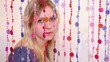 Video: girl sit and corrects hair behind curtain of beads girl sit and corrects hair behind curtain of beads