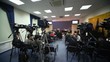 Journalists wait conference in press room, cameras stand around Journalists wait conference in press room, cameras stand around