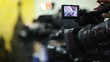 Operator zoom in camera and rotate it, video shown on display