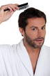 Man brushing his hair
