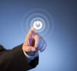 Photo: Man's finger pressing virtual power button on touch screen Man's finger pressing virtual power button on touch screen