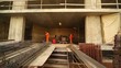 Two labourer weld metal gratings by acetylene torches