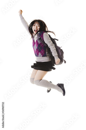 Photo: Chinese school girl jumping into air. Chinese school girl jumping into air.