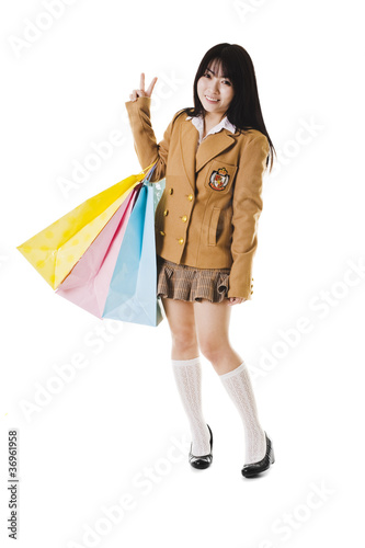 Photo: Chinese school girl shopping. Chinese school girl shopping.
