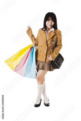 Photo: Chinese school girl shopping. Chinese school girl shopping.