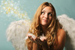 Christmas: beautiful blond angel with stars and snowflakes
