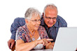 Seniors couple using a computer laptop