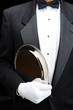 Butler with silver tray under his arm Butler with silver tray under his arm