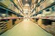 Store racks with product boxes. Motion effect.