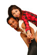 Smiling young man piggybacking his pretty Wife