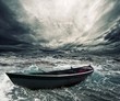 Photo: Abandoned boat in stormy sea Abandoned boat in stormy sea