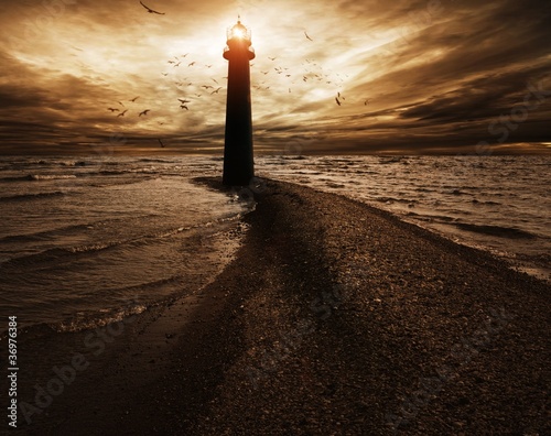 Photo: Stormy sky over lighthouse Stormy sky over lighthouse