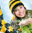 Christmas Girl. Winter Teenage girl Blowing Snow