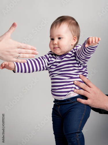 Photo: First steps of a baby girl First steps of a baby girl