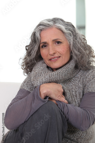 Photo: Portrait of a woman wearing gray clothing Portrait of a woman wearing gray clothing