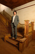 Man on Stairs in an Old House