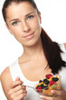 woman eating fruit salad woman eating fruit salad