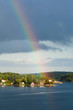 rainbow under small village on Baltic seashore rainbow under small village on Baltic seashore