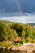rainbow under small village rainbow under small village