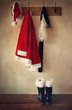 Foto: Santa costume with boots on coatrack Santa costume with boots on coatrack